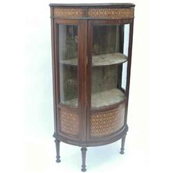 A mahogany and marquetry display cabinet of demi-lune form, having dentil cornice over a glazed a...