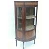Image 1 : A mahogany and marquetry display cabinet of demi-lune form, having dentil cornice over a glazed a...