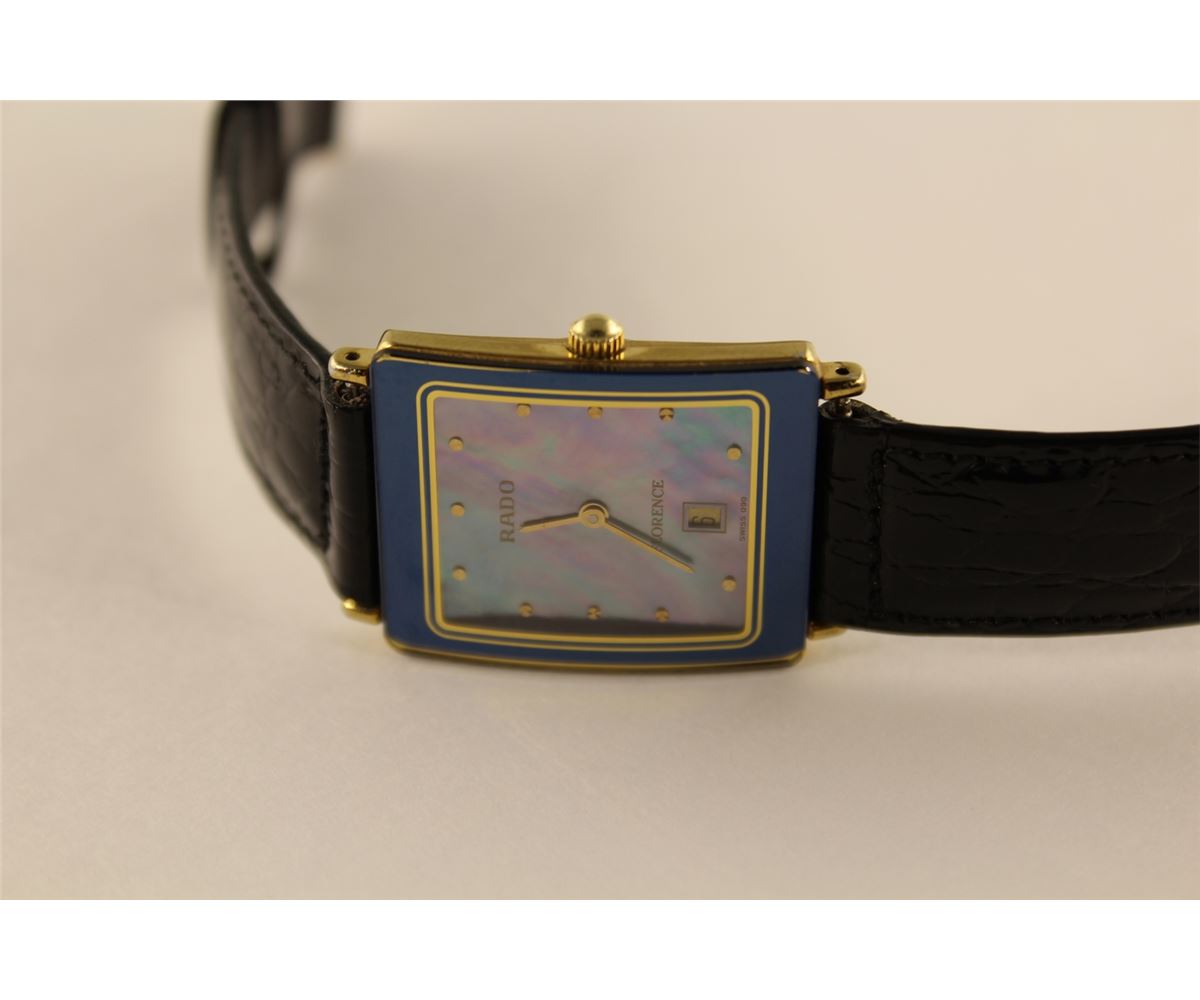 Ladies Rado Florence Wrist Watch Featuring A Blue Mother Of Pearl Dial With Yellow Gold Tone Hour