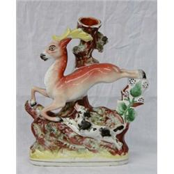 STAFFORDSHIRE POTTERY FIGURAL VASE, English. 19th Century. Of a leaping deer chased by a black...
