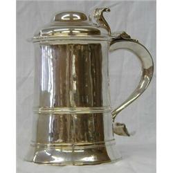 GEORGE III STERLING SILVER TANKARD, English. London. 1779. Maker: Thos. Wallis. The cylindrical...