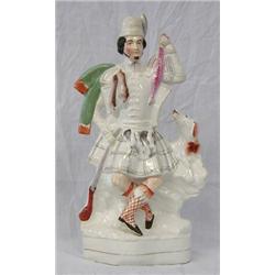 STAFFORDSHIRE POTTERY GROUP, English. 19th Century. Of a Scottish hunter with his hound carryin...