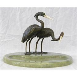 ART DECO PATINATED BRONZE, IVORY AND ONYX PEN TRAY, European. Circa 1930. The circular bowl wit...