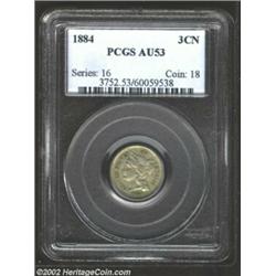 1884 3CN AU53 PCGS. Although there is a little bit of residue that has settled in the devices, no ob