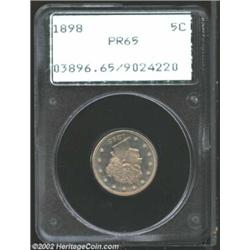 1898 5C PR65 PCGS. This is a modestly reflective Gem that shows pastel tan-olive patina on both side