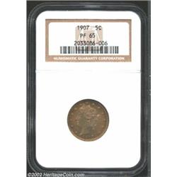 1907 5C PR65 NGC. The fully struck proof surfaces are unmarked and covered by lovely caramel-brown t