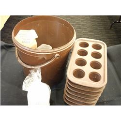 PAIL OF SEVEN SILICONE MOLDS AND PAPER LINERS