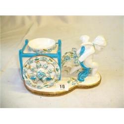 PORCELAIN CHERUB AND CART ORNAMENT BY T. GOODE & CO, LONDON WITH POSY HOLDER INSET. AXLE DAMAGED...