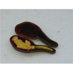 A CASED MEERSCHAUM CHEROOT HOLDER, bird on branch  £20-30...