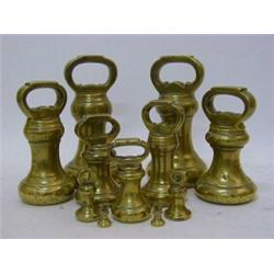 A COMPOSITE SERIES OF ELEVEN BRASS BELL WEIGHTS, late 19th Century, 7lb to 1/2 oz, makers Irk & G...