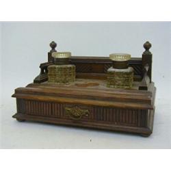 A VICTORIAN OAK DESK STAND, c.1890, twin cut glass inkwells over a frieze drawer, width 28cm  £30...