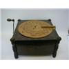 Image 1 : AN EDWARDIAN TABLE TOP POLYPHON, ebonised and gilt incised case, marked 'Ariston', with cardboard...