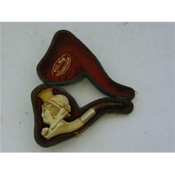 A CASED MEERSCHAUM CIGARETTE TUBE, carved with the head of a grisette, length 10cm  £20-30...