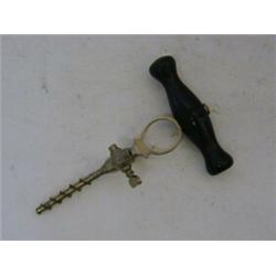 A WHITE METAL CHAMPAGNE TAP, unnamed, turned treen handle, length 15cm and another tap (2)  £20-3...