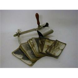 A STEREOSCOPIC VIEWER, (metal) and photographic cards, subjects include Royalty, topographical, (...