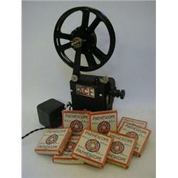 A BOXED PATHESCOPE 'ACE' PROJECTOR, first half of the 20th Century, 9.5mm, with eight boxed reels...