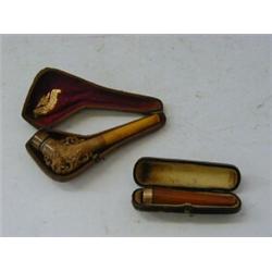 A CASED MEERSCHAUM CHEROOT HOLDER, late 19th, early 20th Century, carved grotesque, case marked '...