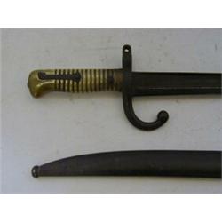 A MILITARY BAYONET, late 19th Century, metal scabbard, ribbed brass grip, length 72cm  £30-40...