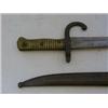 Image 1 : A MILITARY BAYONET, late 19th Century, metal scabbard, ribbed brass grip, length 72cm  £30-40...