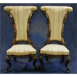 A pair of fine quality Victorian carved walnutwood show frame Pri-Dieu chairs on cabriole support...