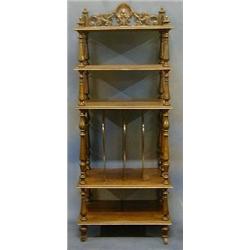 A Victorian simulated rosewood 5 tier what-not stand with pierced three-quarter gallery, the base...