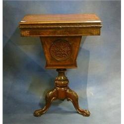 A Victorian inlaid figured walnutwood work table fitted  a deep basket and raised on pillar and t...