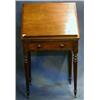 Image 1 : A Georgian mahogany architects table fitted a rising top, the front fitted a brushing slide and w...
