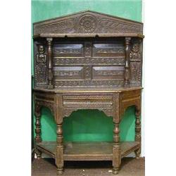 A 17th Century carved oak Credence table fitted a drawer with undertier, raised on turned support...