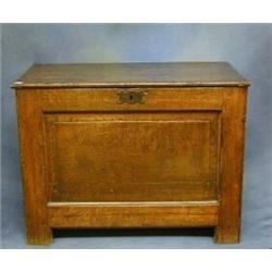 A 17th Century oak coffer of panelled construction 35" £500-700...