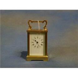 A 19th Century French 8 day carriage clock with enamelled dial and Roman numerals £150-200...