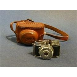 An Mycro IIIA miniature camera complete with leather case £30-50...