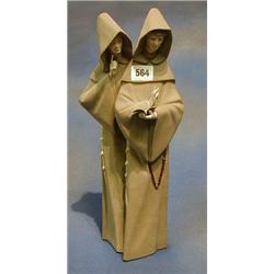 A Lladro figure of 2 standing monks, the base marked Lladro with matt finish 14" £100-150...