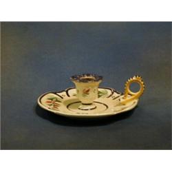 A circular Quimper chamber stick the base marked Ste Honorine £15-25...