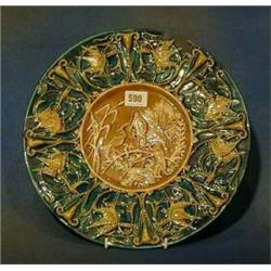 A Continental circular Majolica plate decorated storks the base impressed 584 V Chutz Lamski  13"...