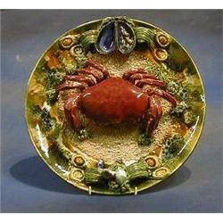 A Continental Majolica plate decorated a crab 14" £75-125...