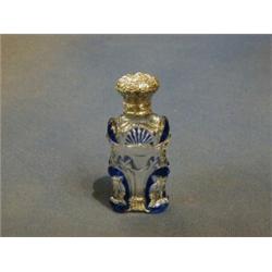 A Victorian cut glass and blue overlay scent bottle with embossed silver hinged lid complete with...
