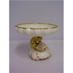 SMALL WHITE COMPORT,with fish support on shell base,with glided highlights. Circa 1881 30 - 50...