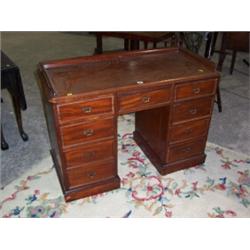 VICTORIAN MAHOGANY PEDESTAL DESK,with galleried top central drawer planked each side by a flight...