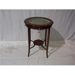 EDWARDIAN MAHOGANY BIJOUTERIE TABLE,with boxwood string border,and glazed cir cular top square ta...