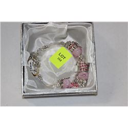 SILVER CHARM BRACELET WITH PINK STONES