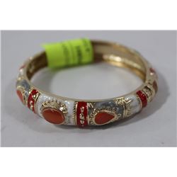 RED WHITE AND GOLD TONE BRACELET