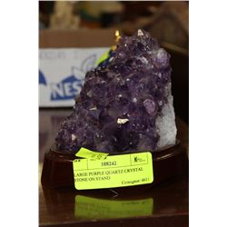 LARGE PURPLE QUARTZ CRYSTAL STONE ON STAND
