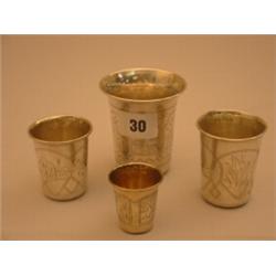 Graduated set of four Russian silver marked measures with etched decoration…