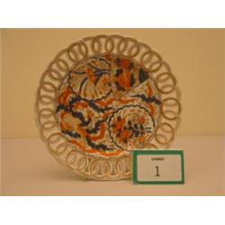 Imari patterned reticulated plate painted with blues and reds, bears puce mark to base, 8.5" diam…
