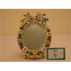 Meissen ladies dressing table mirror decorated with cherubs and flowers, some damage, bears mark …