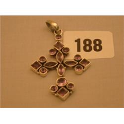 Silver cross pendant set with cut amethysts…
