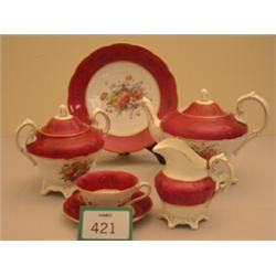 Late 19c twelve place setting handpainted tea set with floral decoration, crimson and gold to bor…