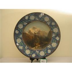 Continental round charger 21" in diameter, rim embossed with flowers, centre handpainted in oil, …