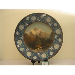 Continental round charger 21" in diameter, rim embossed with flowers, centre handpainted in oil, …