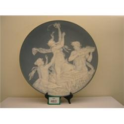 Superb Mettlach plaque 20.5" diameter, depicting classical scene in relief of maidens playing at …